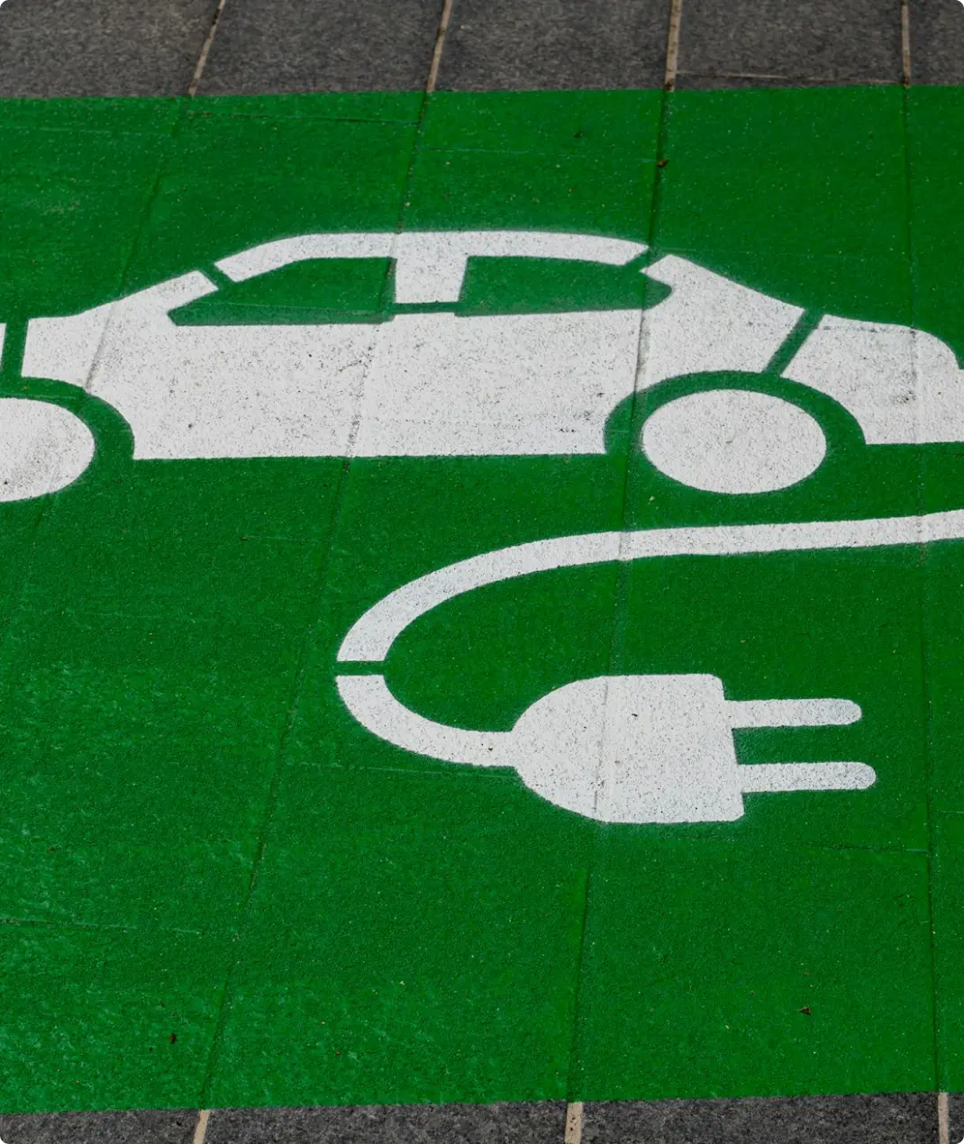 Electric car charging point painted on road