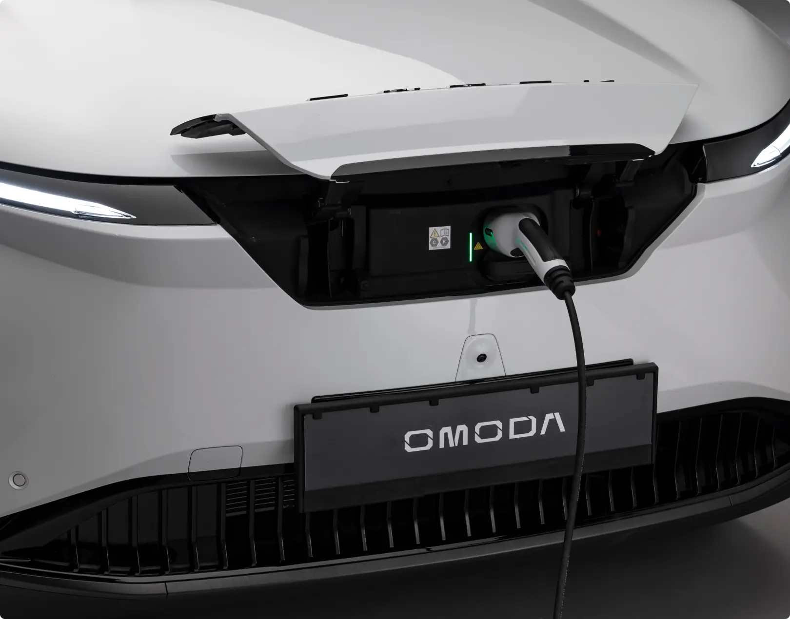 White OMODA E5 being charged