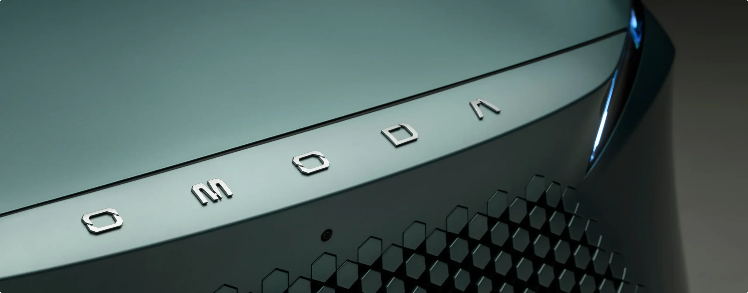 Close up of the OMODA logo on an OMODA 7 SUV