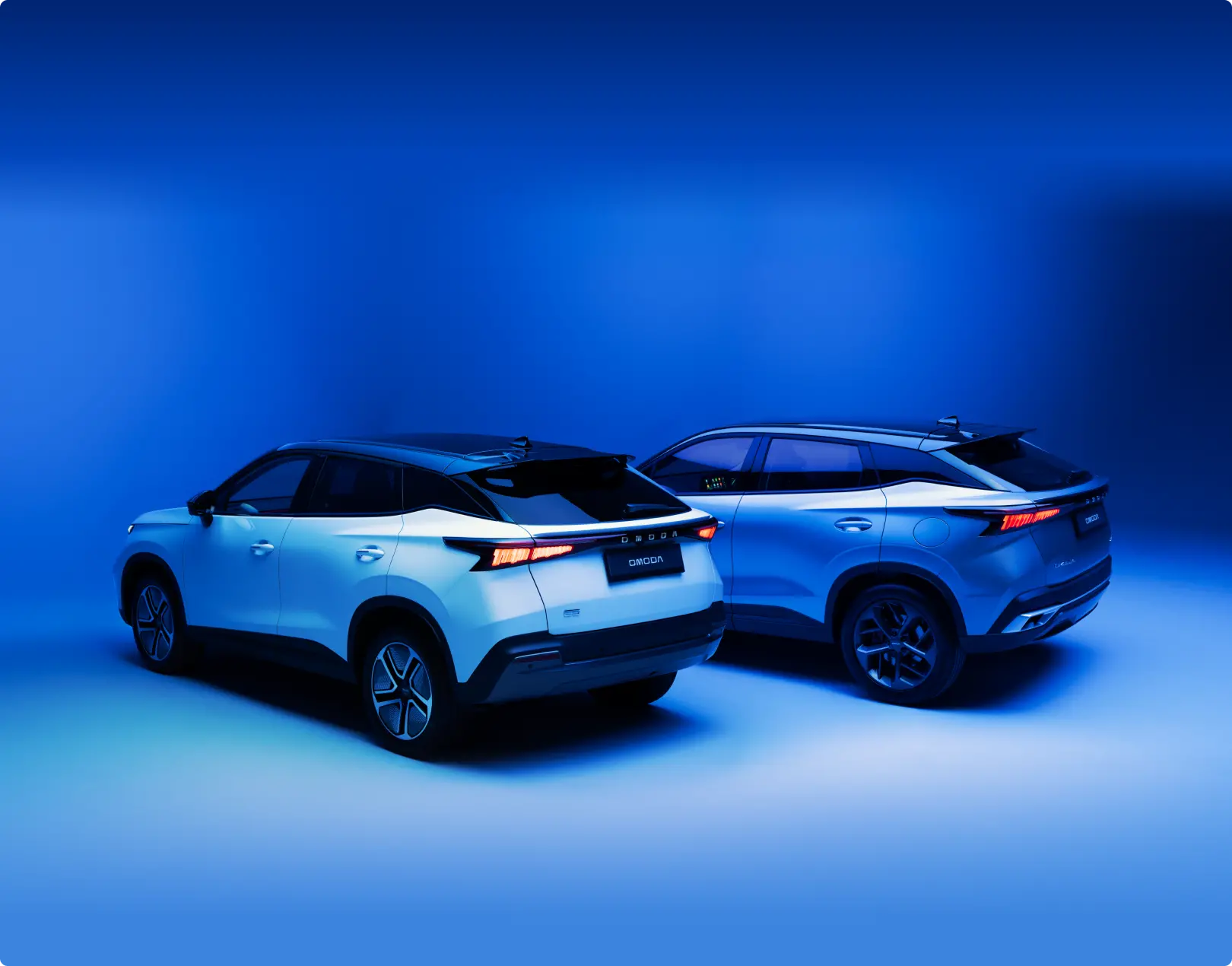 Rear shot of two OMODAs in a blue background