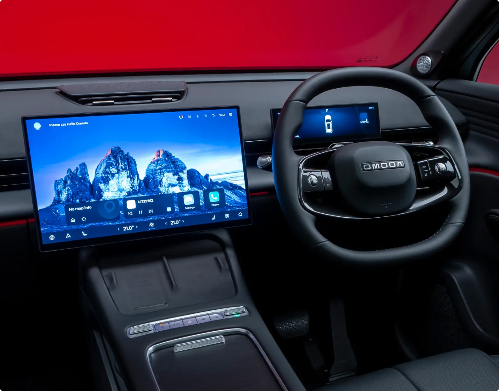 Close up of the touch screen and steering wheel in an OMODA SUV