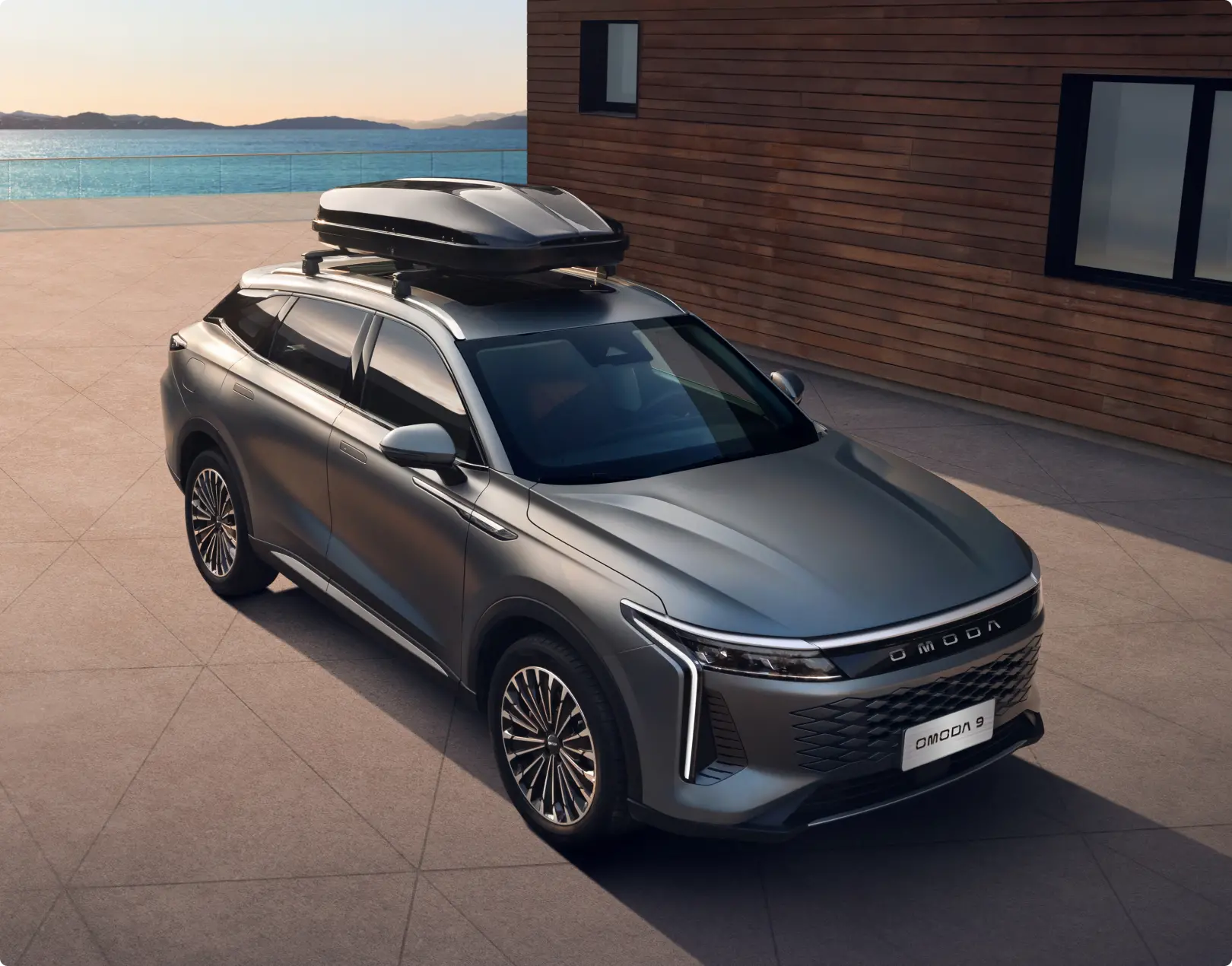 OMODA 9 SUV parked by the sea