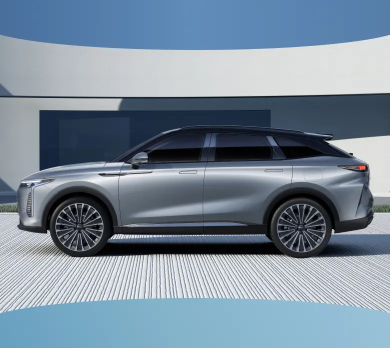 Side profile of grey OMODA 9 surounded by white house