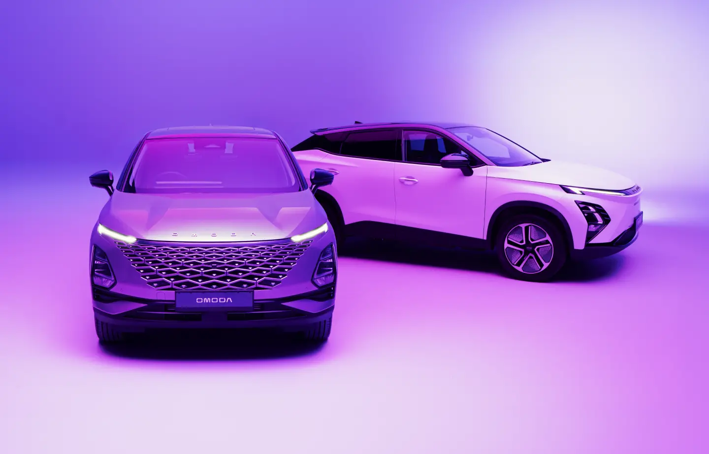 Two OMODA cars in purple environment