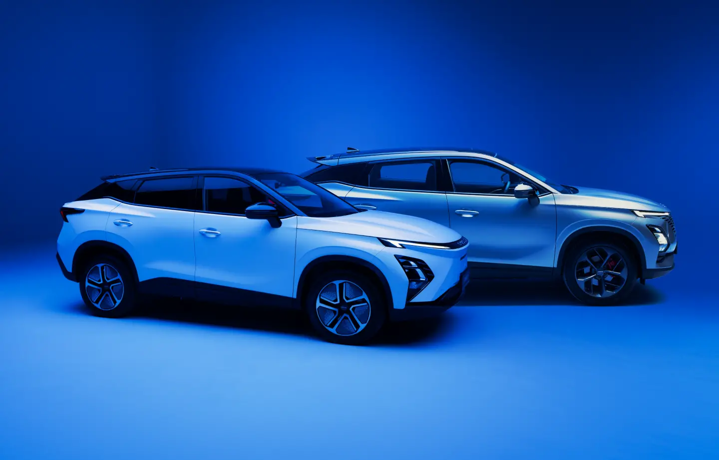 Side profile of two OMODAs in a blue background