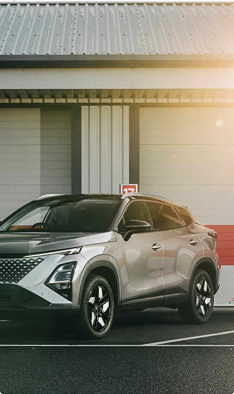 Silver OMODA 5 SHS-H SUV parked outside in a parking space