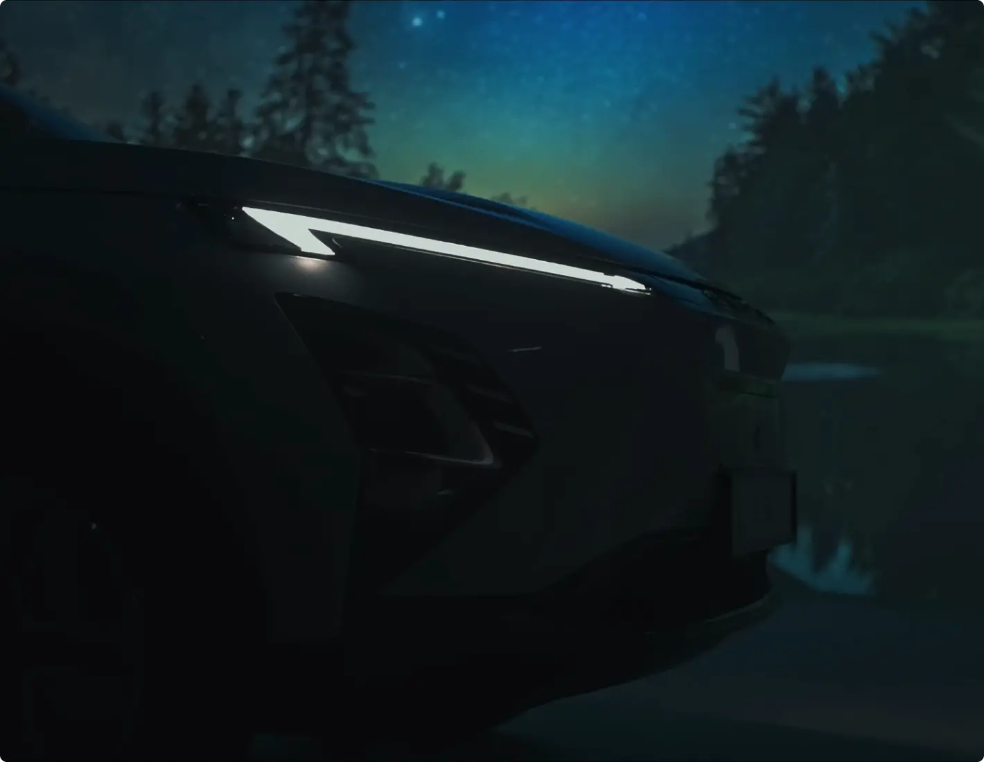 Side night shot of OMODA car headlines